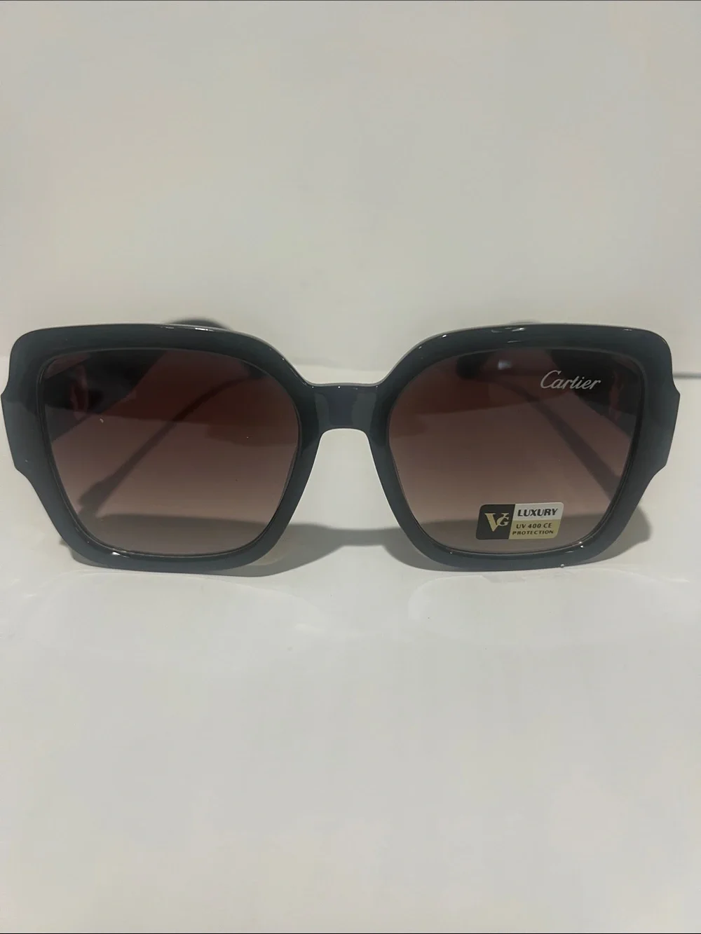 Cartier Women's Black Frame Sunglasses with Brown Gradient Lenses